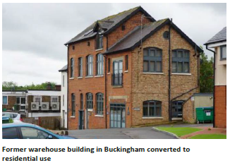 View of a warehouse building with an extended wing. Annotated with: Former warehouse building in Buckingham converted to residential use. 